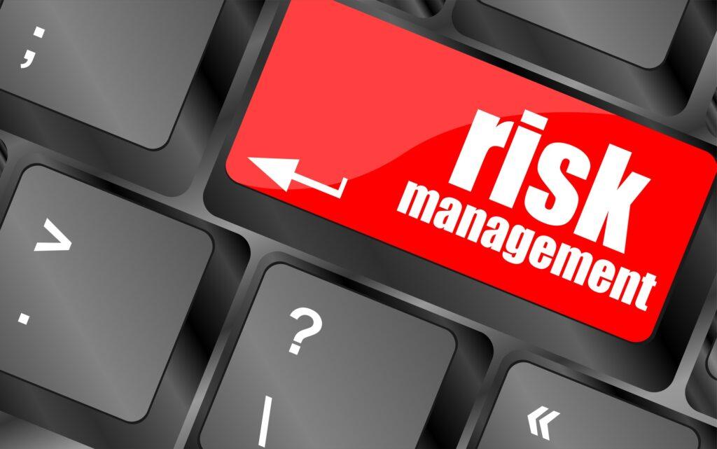 Keyboard with risk management button, internet concept Keyboard with risk management button