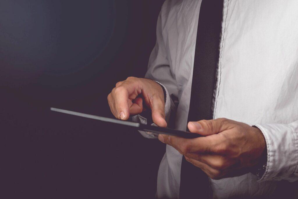 man working on a tablet Image of a man working on a tablet