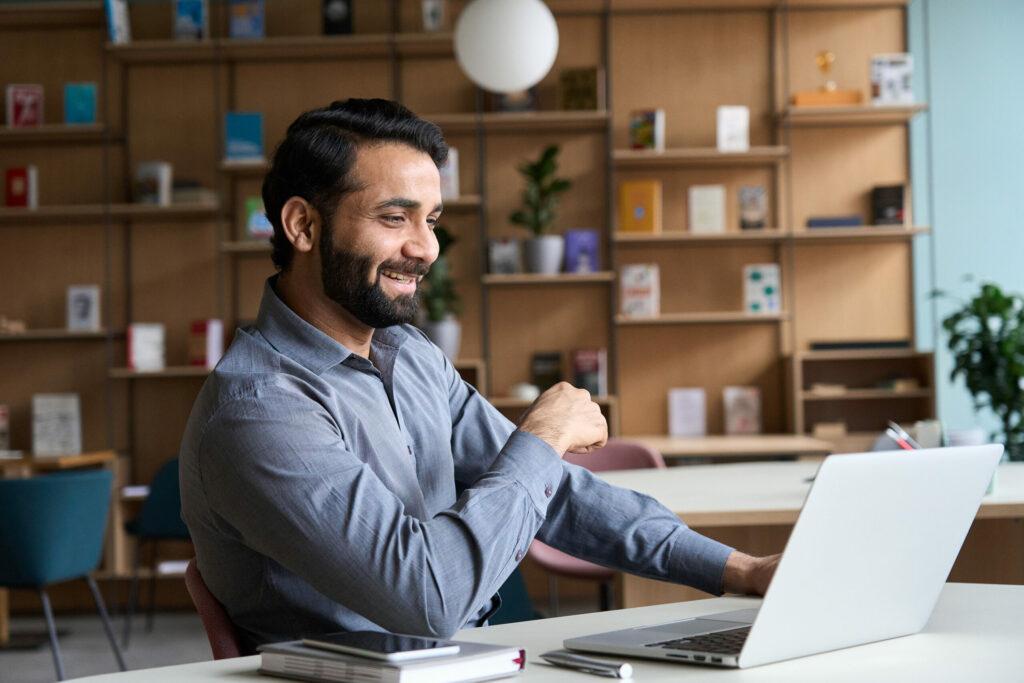 Happy Indian Professional Young Adult Man Having Video Conferenc man happy with IT security training